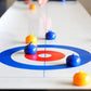 Juegos de curling sobre la mesa