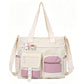 Bolso tote de lona con gran capacidad y múltiples bolsillos